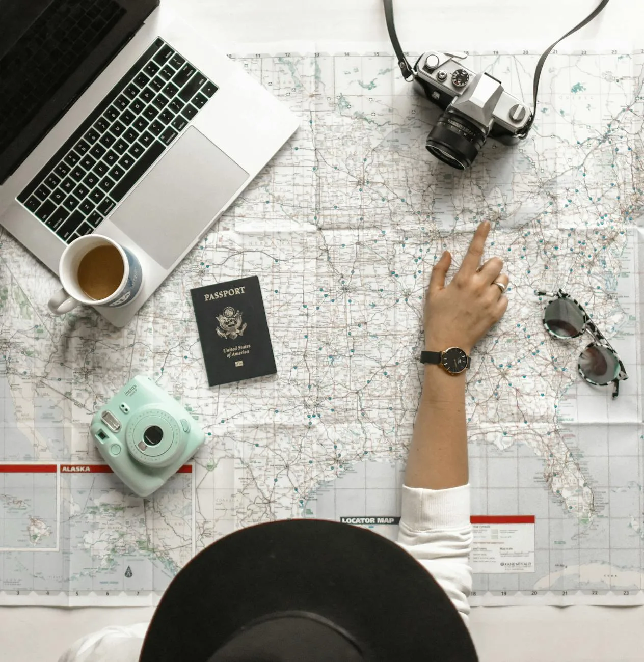 Credit card hacks for travel enthusiasts—person pointing a location on the map