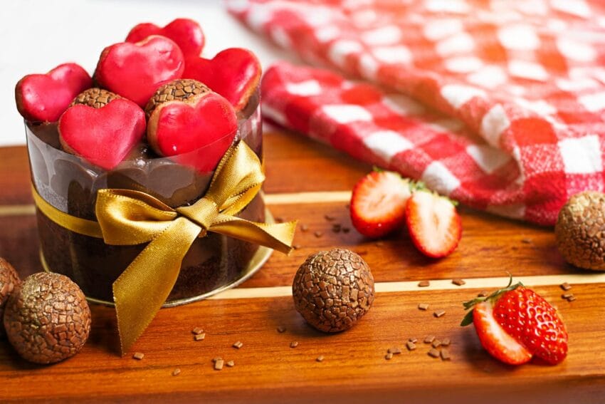 a close up shot of a chocolate cake on a wooden surface