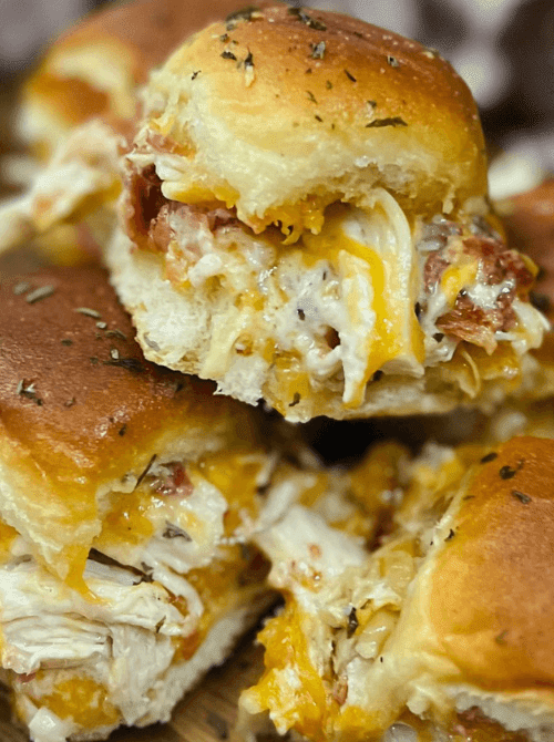 Cheesy chicken bacon ranch sliders on golden Hawaiian rolls—savory, melty, and perfect for Super Bowl food ideas.D