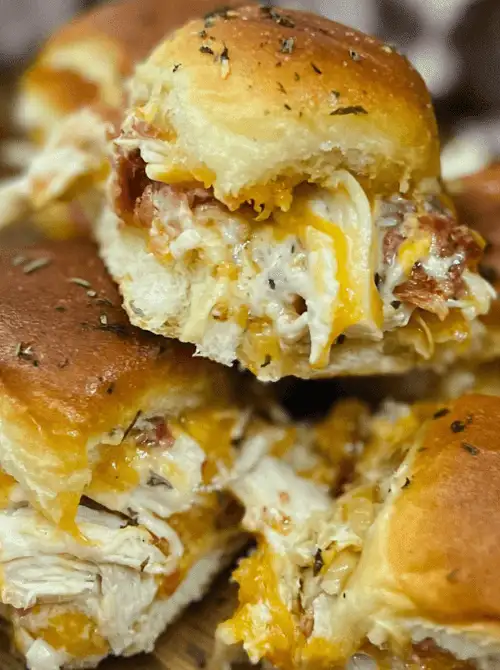 Cheesy chicken bacon ranch sliders on golden Hawaiian rolls—savory, melty, and perfect for Super Bowl food ideas.D