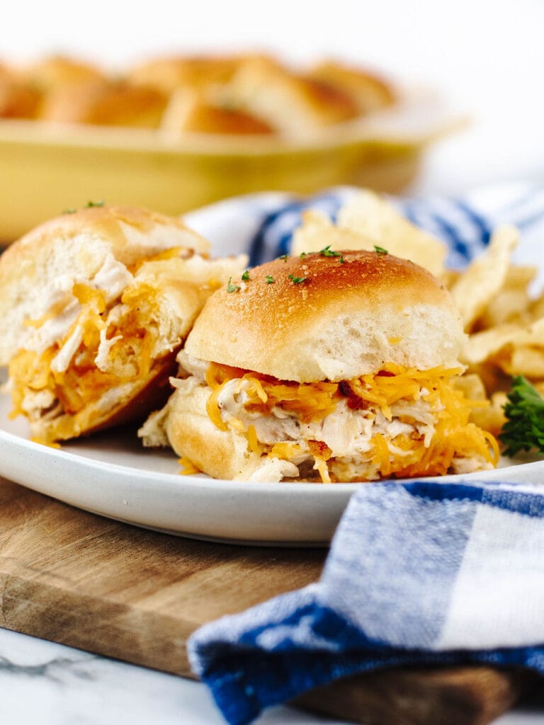 Cheesy turkey sliders with shredded leftover turkey, melted cheese, and soft golden buns, showcasing a zero-waste approach to leftovers recipes.