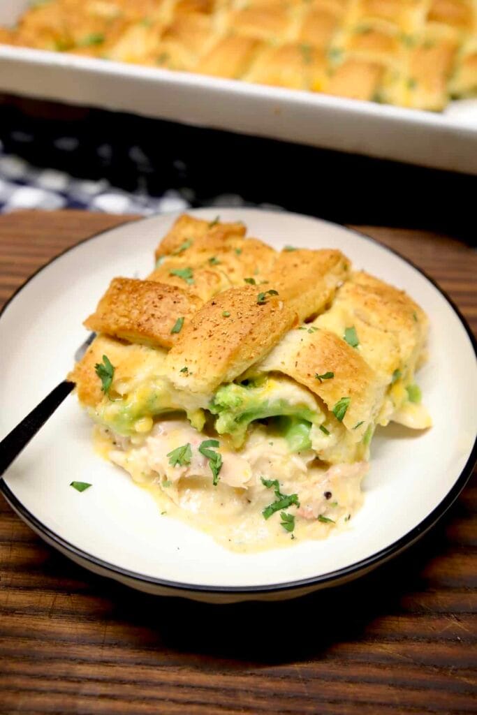 A creamy turkey casserole topped with golden pastry and broccoli florets, highlighting a zero-waste approach to leftovers recipes.