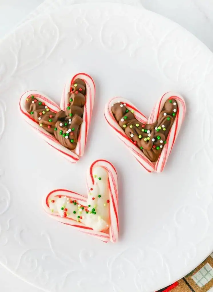 Heart-shaped candy canes filled with chocolate and sprinkles, a perfect idea for romantic desserts for two on a budget.