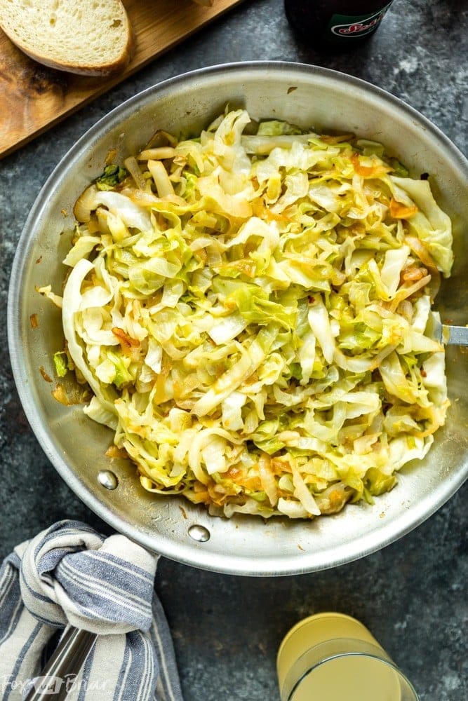 Skillet filled with sautéed cabbage, caramelized onions, and seasonings, a flavorful and simple side dish perfect for St. Patrick's Day food ideas and traditional Irish recipes.Z