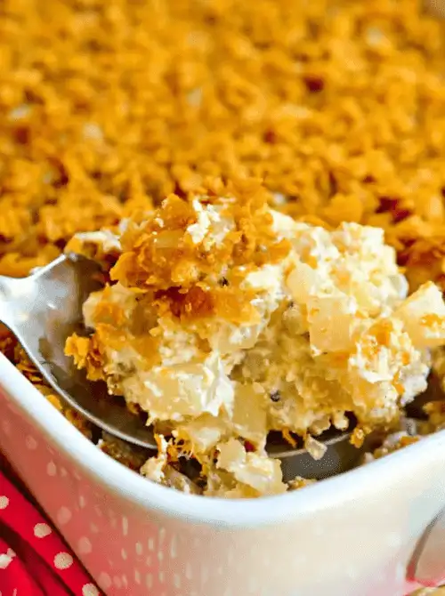 Creamy funeral potatoes topped with a golden, crispy cornflake crust—comforting and budget-friendly for Super Bowl food ideas.