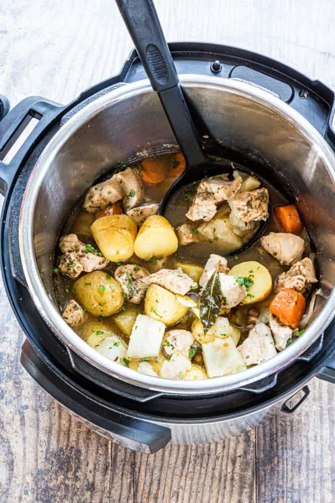 Instant Pot Irish chicken stew filled with tender chicken, baby potatoes, carrots, and onions in a flavorful broth, perfect for quick and easy St. Patrick's Day food ideas and traditional Irish-inspired recipes.