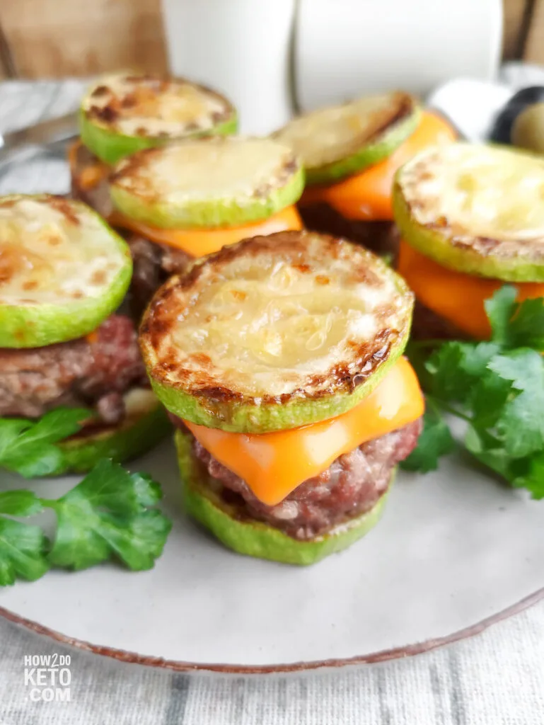 Mini keto burgers made with zucchini slices as buns, layered with juicy beef patties and melted cheese. A low-carb and creative Super Bowl food idea for health-conscious game day fans.