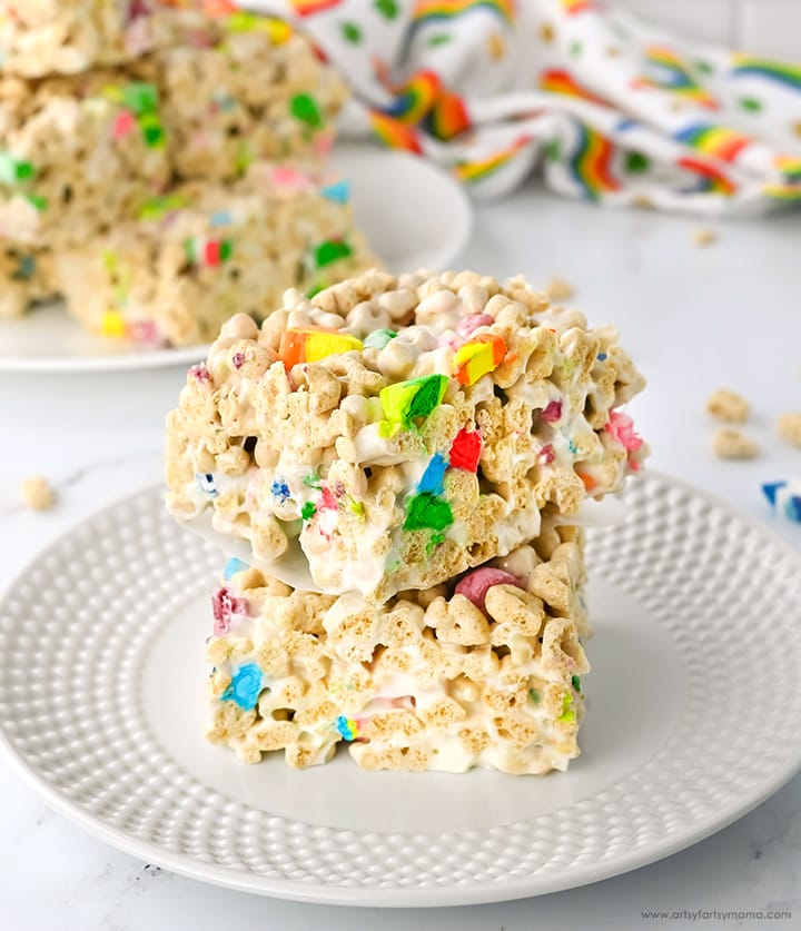 Stack of colorful marshmallow cereal treats made with festive rainbow-colored pieces, perfect for St. Patrick's Day food ideas and whimsical Irish-inspired desserts.