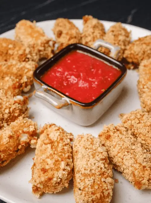 Crispy panko mozzarella sticks arranged around a dish of marinara sauce—an easy and crowd-pleasing option for Super Bowl food ideas.