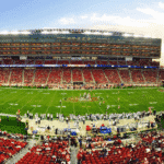 nfl stadium field full with crowd watching the game during daytime