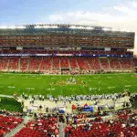 nfl stadium field full with crowd watching the game during daytime