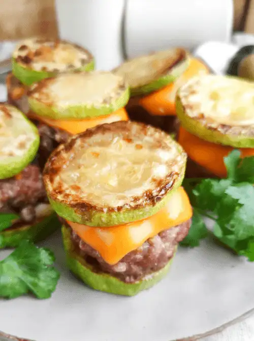 Mini keto zucchini sliders layered with cheddar cheese and ground beef—low-carb and fun for creative Super Bowl food ideas.