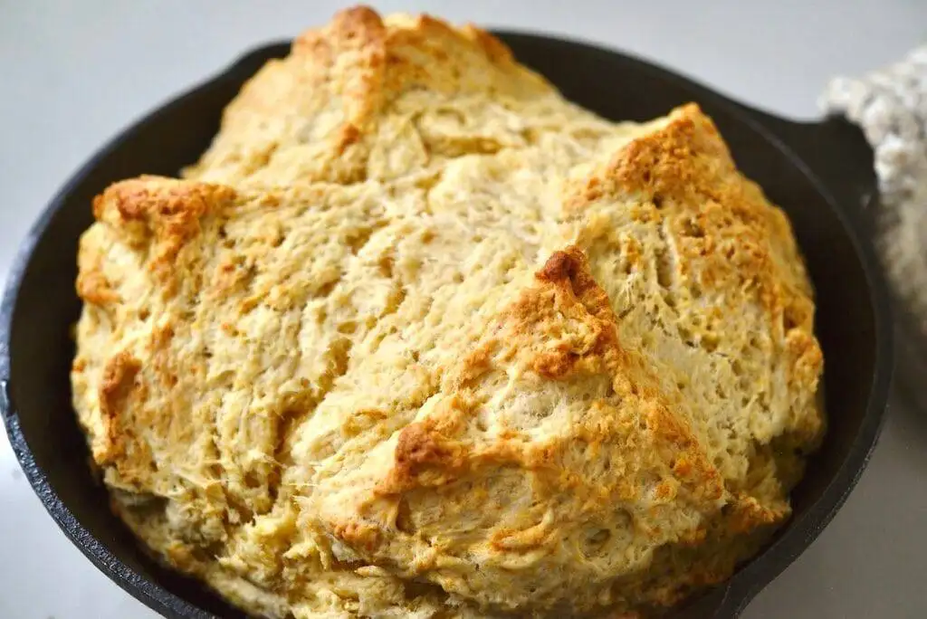 Golden-brown Irish soda bread with a rustic crust and tender crumb, perfect for pairing with stews, soups, or dips at your Irish party food celebration!