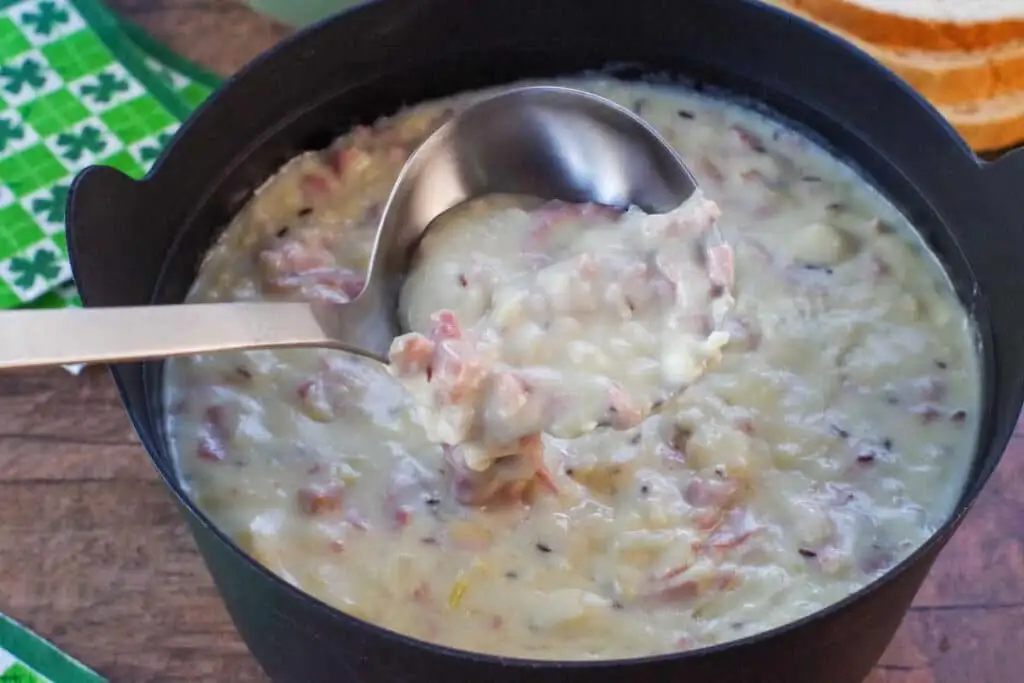 Creamy Reuben soup loaded with tender corned beef, sauerkraut, and a cheesy broth, perfect for a warm and comforting addition to your Irish party food spread!