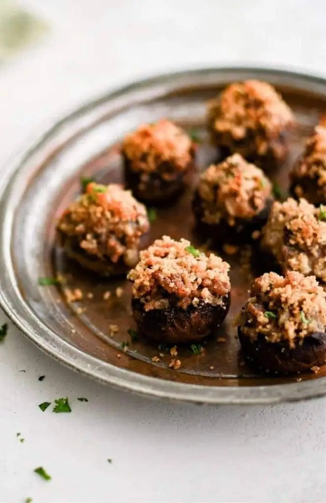 Savory stuffed mushrooms topped with a golden, crispy breadcrumb crust, a flavorful bite-sized addition to your Irish party food spread.
