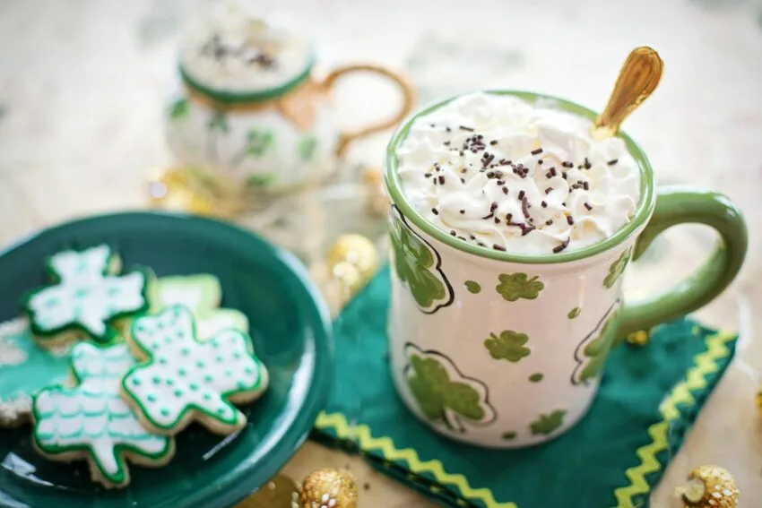 a ceramic mug with whipped cream