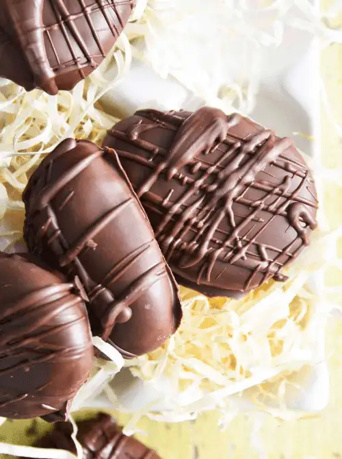 Homemade chocolate-covered peanut butter eggs with a smooth, creamy filling—perfect for easy Easter finger food ideas and a delicious holiday treat!