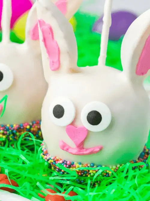 Adorable white chocolate bunny cake pops decorated with candy eyes and sprinkles—perfect for easy Easter finger food ideas and festive holiday treats!