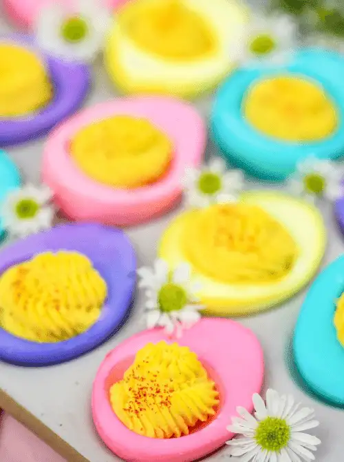 Vibrant pastel-colored deviled eggs with creamy yellow filling, perfect for easy Easter finger food ideas. A fun and festive appetizer for spring celebrations!