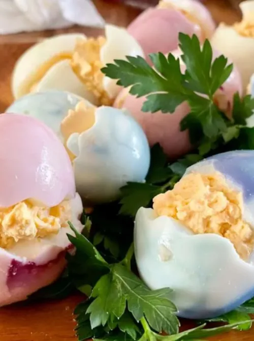Beautiful pastel-colored marbled deviled eggs with a creamy filling, designed to look like cracked Easter eggs—perfect for easy Easter finger food ideas and spring celebrations!