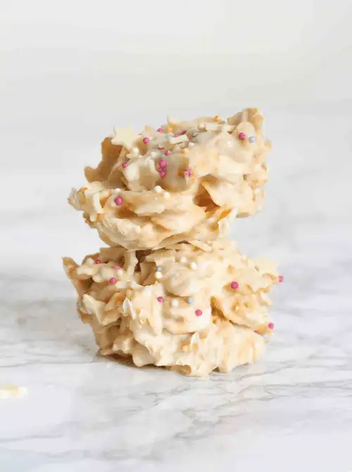 White chocolate cornflake clusters topped with pastel sprinkles—perfect for easy Easter finger food ideas and a crunchy, no-bake holiday treat!