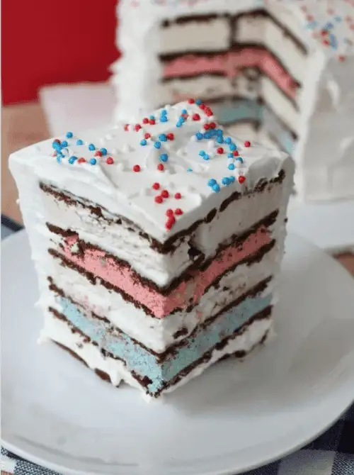Layered no-bake ice cream sandwich cake with red, white, and blue whipped topping and sprinkles—an easy 4th of July dessert that’s festive, freezer-friendly, and perfect for summer celebrations.