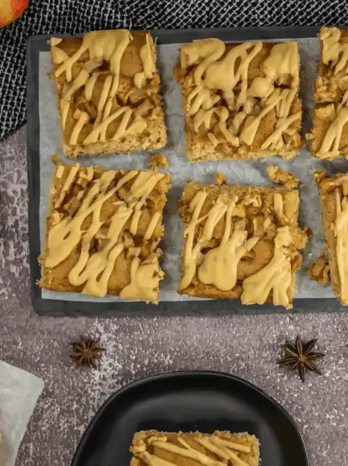 Iced apple cookie bars with chunks of apple and drizzled glaze—easy fall desserts and one of the best things to make with apples for potlucks, lunchboxes, or sweet snacking.