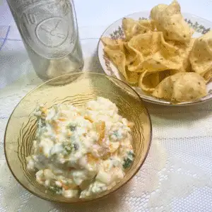 Bowl of creamy Apricot Jalapeño Popper Dip served with a side of corn chips, ready for game day or party snacking.