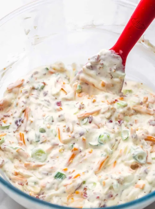 Creamy bacon and cheese dip with green onions in a glass bowl, perfect for easy game day dips everyone will love.