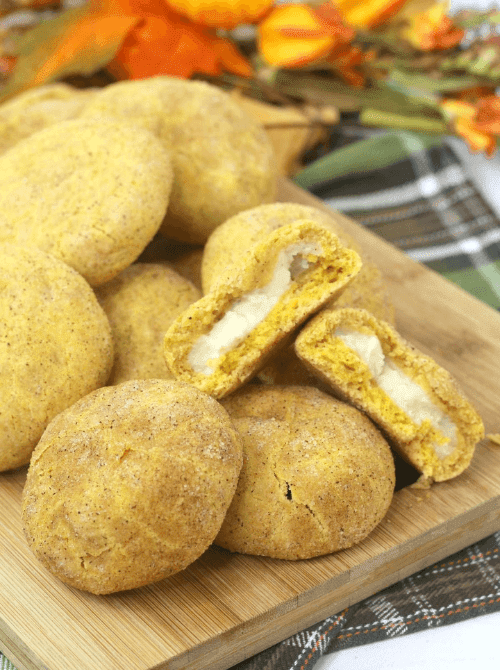 Stuffed pumpkin cookies with cream cheese filling made using leftover pumpkin puree—an easy fall dessert idea for what to make with leftover pumpkin puree.
