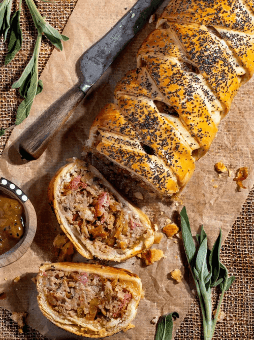 Golden braided pastry filled with sausage, apple, and herb stuffing, topped with poppy seeds—flaky, savory, and one of the most delicious things to make with apples for easy fall recipes and festive gatherings.
