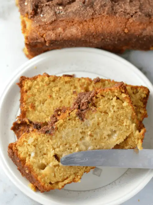 Slices of golden snickerdoodle apple bread with a cinnamon-sugar topping—an irresistible fall bread recipe and a flavorful idea for what to make with apples.