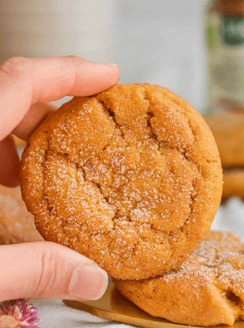 Soft pumpkin snickerdoodle cookie coated in cinnamon sugar, made with leftover pumpkin puree—perfect for fall baking and ideas on what to make with leftover pumpkin puree.