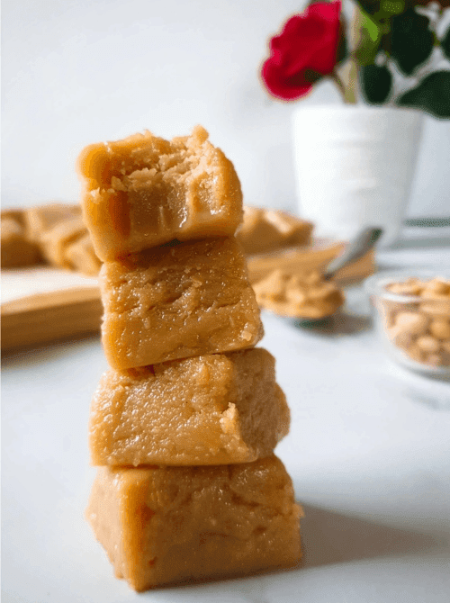 Stack of creamy homemade peanut butter fudge squares, a simple DIY Christmas gift and easy edible gift idea for the holidays.