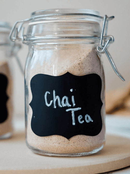 Homemade chai tea mix in a mason jar with a chalkboard label, a cozy idea for DIY Christmas gifts and mason jar recipes.