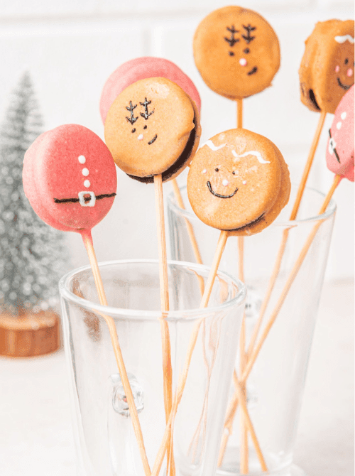 Christmas Oreo pops decorated like Santa, reindeer, and gingerbread, a playful DIY Christmas gift idea featuring cookies and bars.
