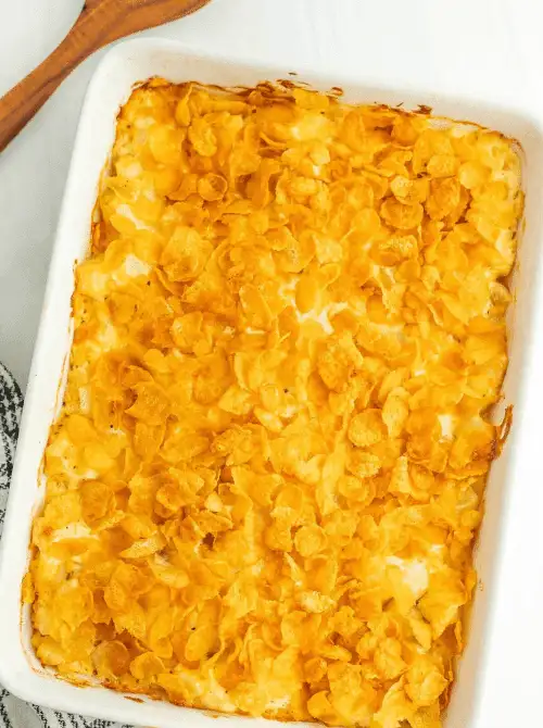 Golden-topped funeral potatoes casserole in a white baking dish, featured in Budget-Friendly Thanksgiving Sides and Easy Potato Recipes for a cheesy holiday favorite.