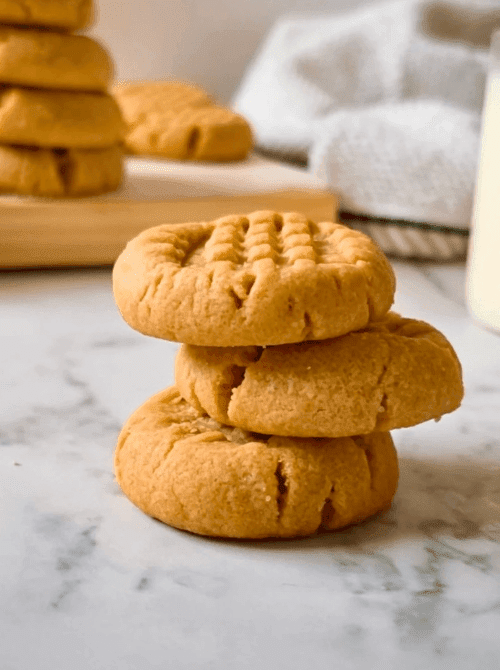 Stack of homemade peanut butter cookies, a simple DIY Christmas gift idea featuring classic cookies and bars.