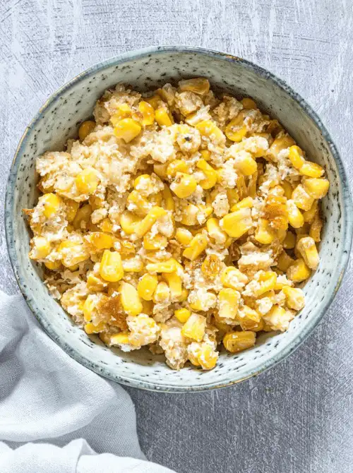 Sweet corn baked into a creamy, golden casserole with a slightly crisp topping—an easy, comforting, and Budget-Friendly Thanksgiving Vegetable Side for your holiday table.