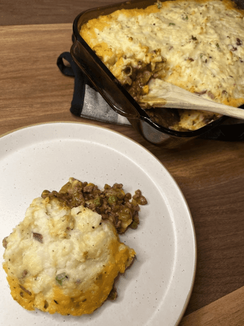 Homemade Shepherd’s Pie made with leftover mashed potatoes, ground beef, and peas – a hearty idea for what to make with Thanksgiving leftovers and recipes that stretch your budget.