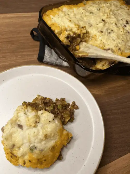 Homemade Shepherd’s Pie made with leftover mashed potatoes, ground beef, and peas – a hearty idea for what to make with Thanksgiving leftovers and recipes that stretch your budget.