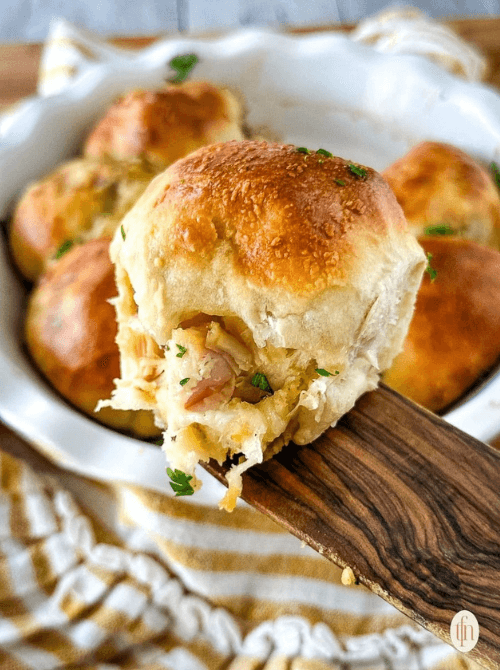 Golden baked dinner rolls stuffed with turkey and cheese – a budget-friendly idea for what to make with Thanksgiving leftovers and recipes that stretch your budget.