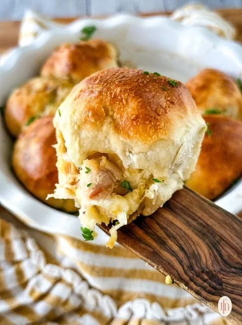 Golden baked dinner rolls stuffed with turkey and cheese – a budget-friendly idea for what to make with Thanksgiving leftovers and recipes that stretch your budget.