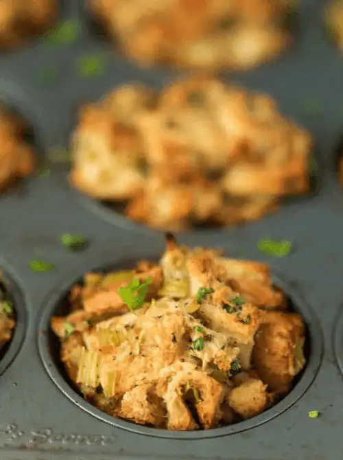 Golden-brown stuffing muffins baked in a muffin tin – a creative idea for what to make with Thanksgiving leftovers and recipes that stretch your budget.