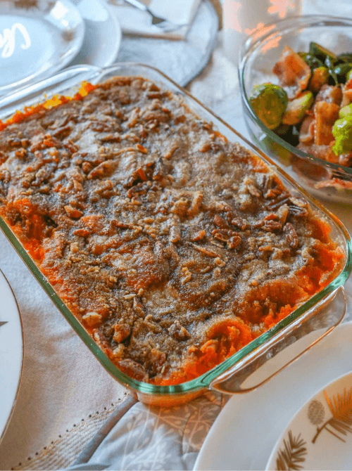 Sweet potato casserole with pecan topping in a glass baking dish, part of Budget-Friendly Thanksgiving Sides and Easy Potato Recipes for a classic holiday dish.