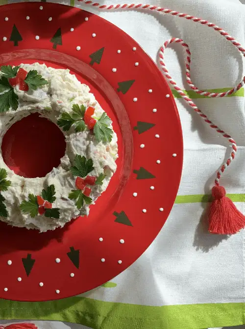 Bacon scallion cheese dip shaped like a holiday wreath and garnished with parsley and red peppers, a festive option for Party Dips for the Holidays with Unique Twists.