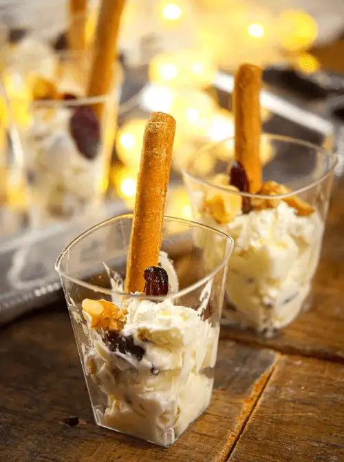 Nutty Cranberry Goat Cheese Shots served in mini cups with breadsticks — a festive, make-ahead Christmas appetizer that’s elegant yet budget-friendly, perfect for Christmas party food ideas, easy finger food appetizers, and creative holiday entertaining on a budget.