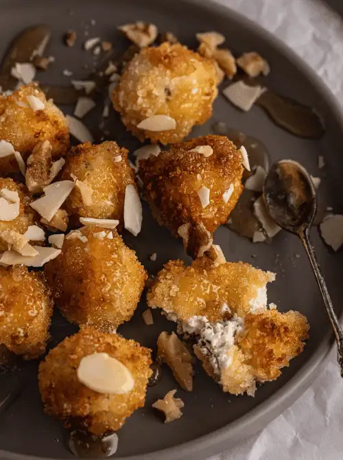 Festive Cheese Ball coated with herbs and chopped nuts — an easy make-ahead appetizer for Christmas party food ideas, perfect for holiday entertaining, budget-friendly finger food appetizers, and crowd-pleasing Christmas gatherings served with crackers.