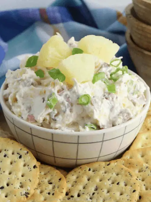 Hawaiian ham and pineapple dip with cream cheese, topped with pineapple chunks and green onions, a sweet-and-savory option for Party Dips for the Holidays with Unique Twists.