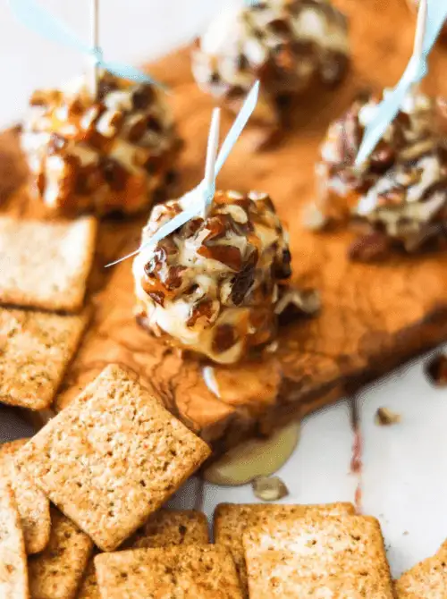 Honey Goat Cheese Balls rolled in chopped pecans and drizzled with honey — an elegant yet budget-friendly appetizer for Christmas party food ideas, perfect for holiday entertaining, easy finger food appetizers, and festive gatherings that impress without spending much.